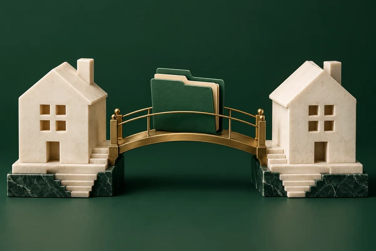 Two abstract ivory homes linked by a brass bridge with a green document folder between them.